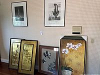 Group photo of six framed art pieces against wall showing overall set