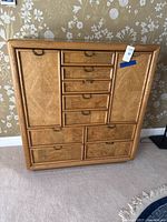 Front view showing nine drawers and side cabinet door closed