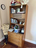 Front view of full modular shelving unit loaded with contents