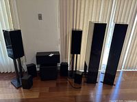 All included speakers and stands arranged along wall