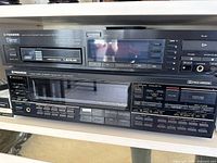 Front view showing both Pioneer Multi Play Compact Disc Player PD-M50 and Pioneer Audio/Video Stereo Receiver VSX-5000 stacked, highlighting display and control buttons.