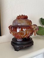 Front and side view of the agate jar on wooden stand