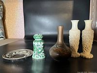 Front view of five items on black background