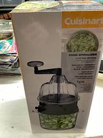 Photo of Cuisinart food spiralizer chopper in original box showing product and usage on packaging.