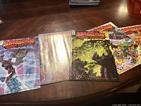 Five BeBop & Rocksteady comic books laid out on wooden table showing front covers from issues 1 to 5