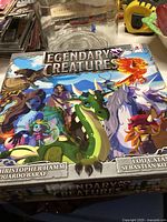 Closed 'Legendary Creatures' board game box featuring colorful fantasy creature artwork on the cover.