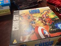 Closed Marvel Crisis Protocol Core Set box with cover artwork showing multiple Marvel characters in action poses.