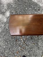 Top view of the table surface showing the wood grain and some light surface wear.