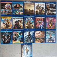 Photo showing all 15 Blu-ray cases arranged on a surface with key titles clearly visible.