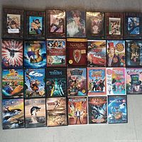 Photo showing all 26 kids DVDs arranged in 4 rows with cover art visible