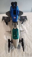 Top view of the Skystalker jet figure showing cockpit and wings with Decepticon logos.