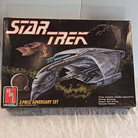 Box front image showing colorful illustrations of the Star Trek ships included in the set, labeled as 3 Piece Adversary Set by AMT Ertl.