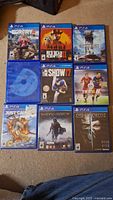 Front cover shot showing 9 PS4 game cases and 1 loose game disc