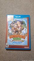 Front of Donkey Kong Country Tropical Freeze Wii U game case showing cover art featuring Donkey Kong characters.