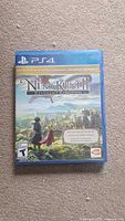 Front cover of Ni No Kuni II: Revenant Kingdom PS4 game case showing title and artwork.