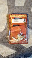 Front view of unopened Warhammer Sorceror of Chaos miniature in blister pack showing the figure and damaged packaging.