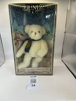 Front view of 1991 GUND Christmas Collectible white plush bear in original box with winter village background scene.