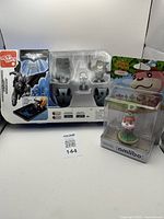 Full lot showing Batman starter set and Animal Crossing amiibo in packaging