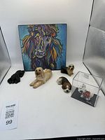 Colorful abstract dog canvas print with six dog figurines arranged in front, various breeds and colors