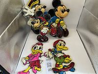 Full view of Mickey Mouse, Donald Duck, and Daisy Duck wall decorations.