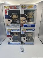 Four Funko Pop figures in original box: John Cena WWE #76, Elaine Seinfeld #1083, Joey Fatone NSYNC #114, Chris Kirkpatrick NSYNC #115.