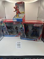 Three boxed Schleich Justice League sets, including Batman vs Joker, Superman vs Darkseid, and The Flash figure.