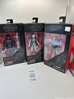 Three boxed Star Wars: The Black Series action figures from Hasbro, displayed upright showing packaging and figures inside.