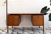 Assembled desk front view showing two pedestal units and center knee space