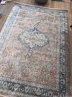 Top-down view of the full rug showing central medallion and border design