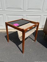 Three-quarter view showing overall table and canvas sling