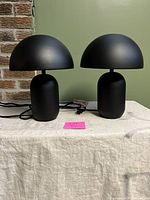 Front view of both lamps side by side on tabletop.