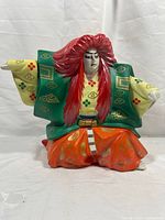 Front view of porcelain samurai warrior decanter showing colours and detailing