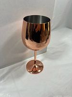 Single copper-tone stemmed goblet side view