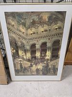 Full view of framed picture showing opera house interior scene.