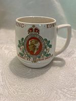 Front view of Edward VIII commemorative mug with profile image and crown on white ceramic.