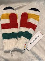 Front side of the HB Stripes mittens showing colorful horizontal stripes and original tag attached.