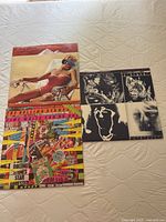 Three Rolling Stones vinyl albums laid out: Made in the Shade, Time Waits For No One, Emotional Rescue.