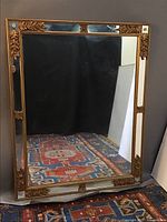 Full frontal view of large rectangular wall mirror showing overall size and frame style.