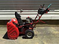 Side view of complete snow blower