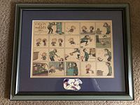 Framed Calvin and Hobbes comic strip print with various colorful panels and characters.