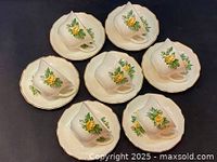 Six George Rose teacups and saucers arranged in pairs showing floral design