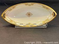 Oval Nippon porcelain service dish with floral and gold trim on stand showing top view