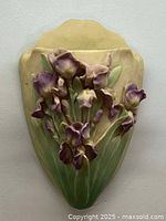 Front view of the purple iris hand-painted Irish alabaster hanging vase showing detailed floral relief and subtle color transitions.