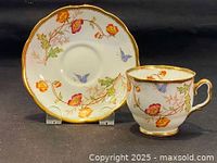 Full view of Royal Albert cup and saucer set with butterflies and flowers hand painted design