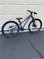 Full side profile of the GT youth mountain bike showing frame design, tires and overall condition