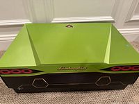 Closed green and black LEGO Technic Lamborghini Sián FKP 37 box showing front and top with Lamborghini logo.