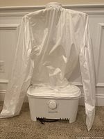 White SereneLife suit steam machine with fabric cover attached, controls visible on the front base unit.