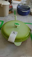 Front view of pale green skillet with lid and size sticker