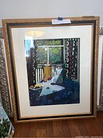 Framed original oil painting with visible ornate frame, showing the full artwork depicting a still life with coffee pot and fruit on table near a window.