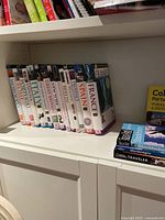 Shelf of hardcover travel guidebooks from Eyewitness Travel including titles for France, Spain, Italy, Vienna, Prague, Belgium, UK, Morocco, New York, and Berlin.